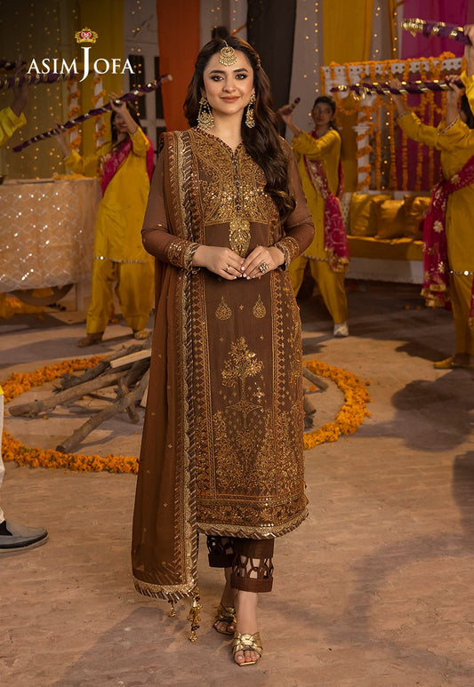"Brown Elegance:Gold-Embroidered Traditional Ensemble at a Festive Mayoon Setup"